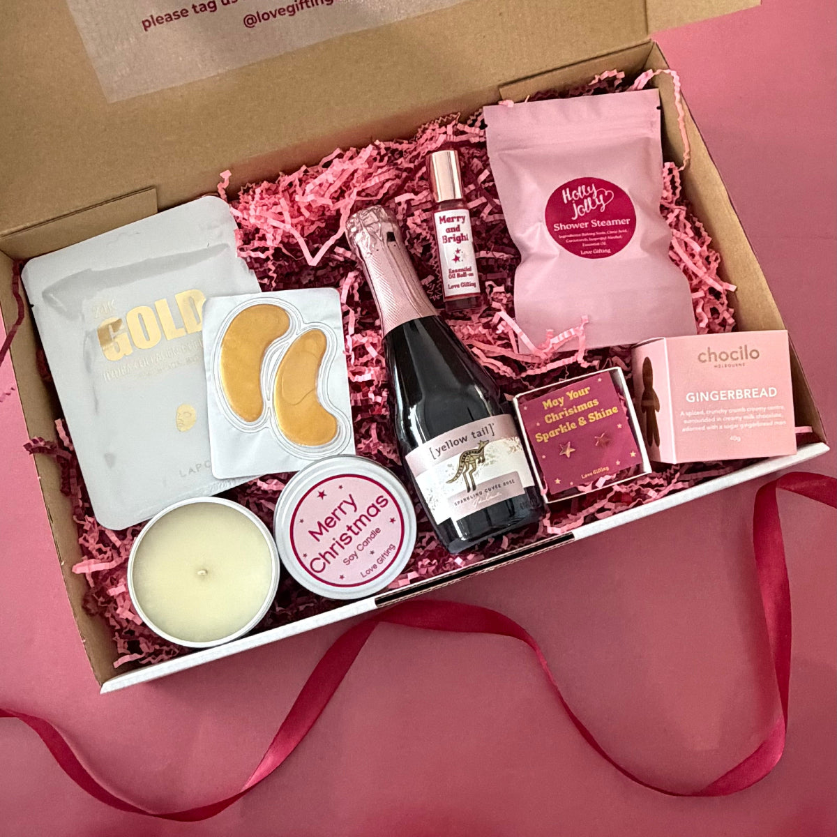 Sip, Sparkle & Gingerbread Christmas Gift Box with sparkling rosé, gingerbread chocolates, candle, jewellery and pamper gifts