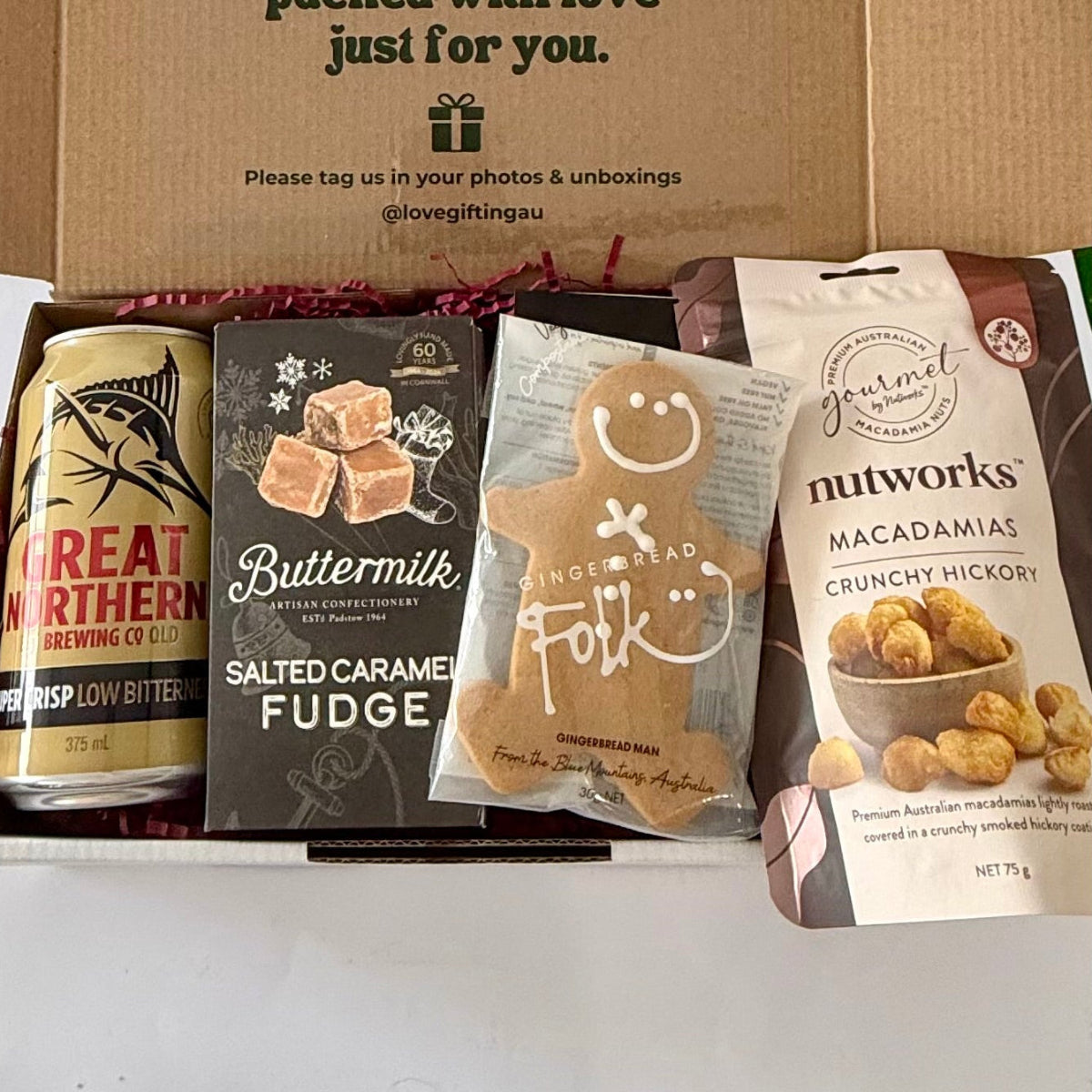 Men's Christmas beer and treats gift box with Great Northern beer, salted caramel fudge, nuts  and gingerbread by Love Gifting.