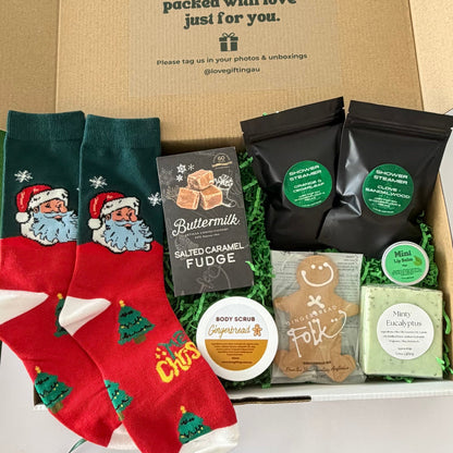 Santa's Chill Out Kit men's Christmas gift box with Santa socks, salted caramel fudge, shower steamers, gingerbread body scrub, soap and lip balm.