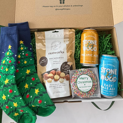 Christmas Cheers & Treats Stone & Wood beer gift box with Pacific Ale, Easy Pale Ale, Nutworks vanilla macadamias, Christmas tree socks and chocolate freckle.