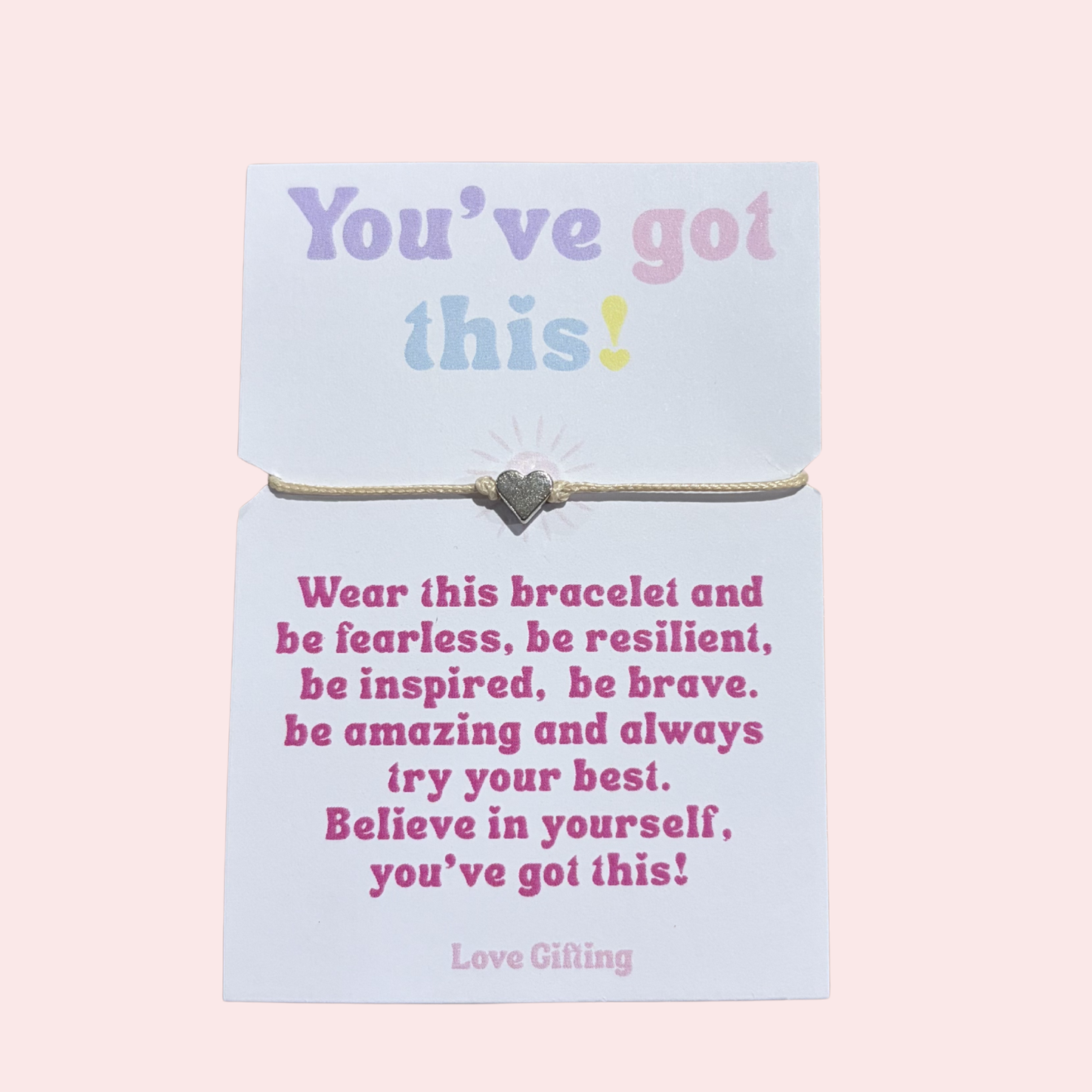 Bracelet on a card with motivational message on a pink background
