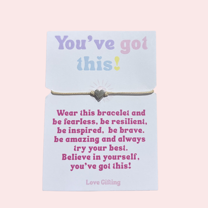 Bracelet on a card with motivational message on a pink background