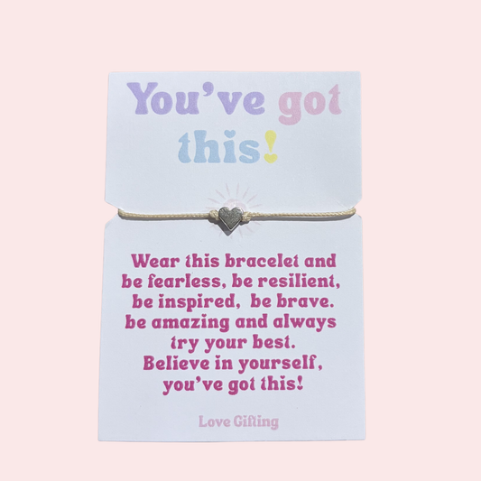 Bracelet on a card with motivational message on a pink background