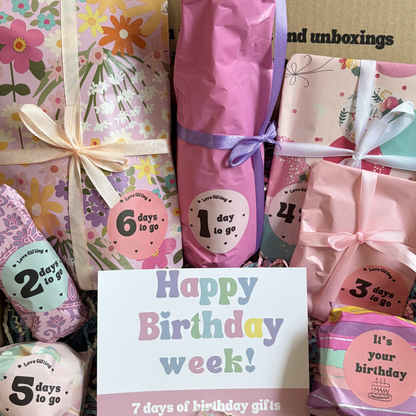 Birthday gift countdown with colorful packaging and a card saying 'Happy Birthday week!'.
