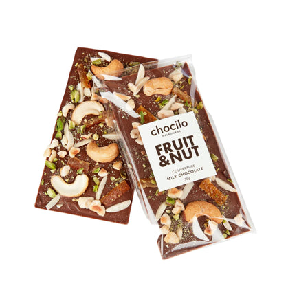 Chocolate bar with fruit and nut toppings and 'chocolito' packaging on a white background