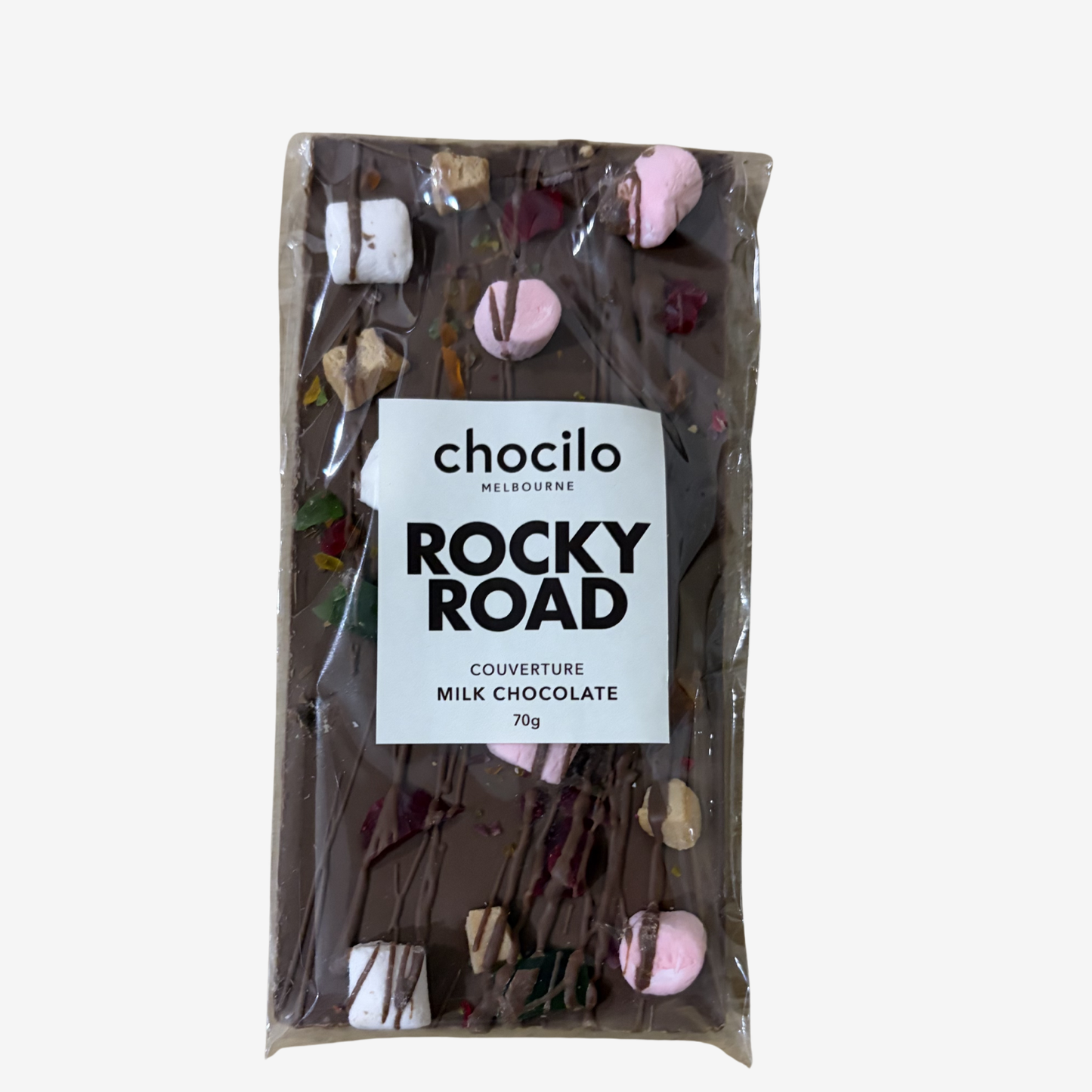Packaged rocky road chocolate bar with visible ingredients on a white background